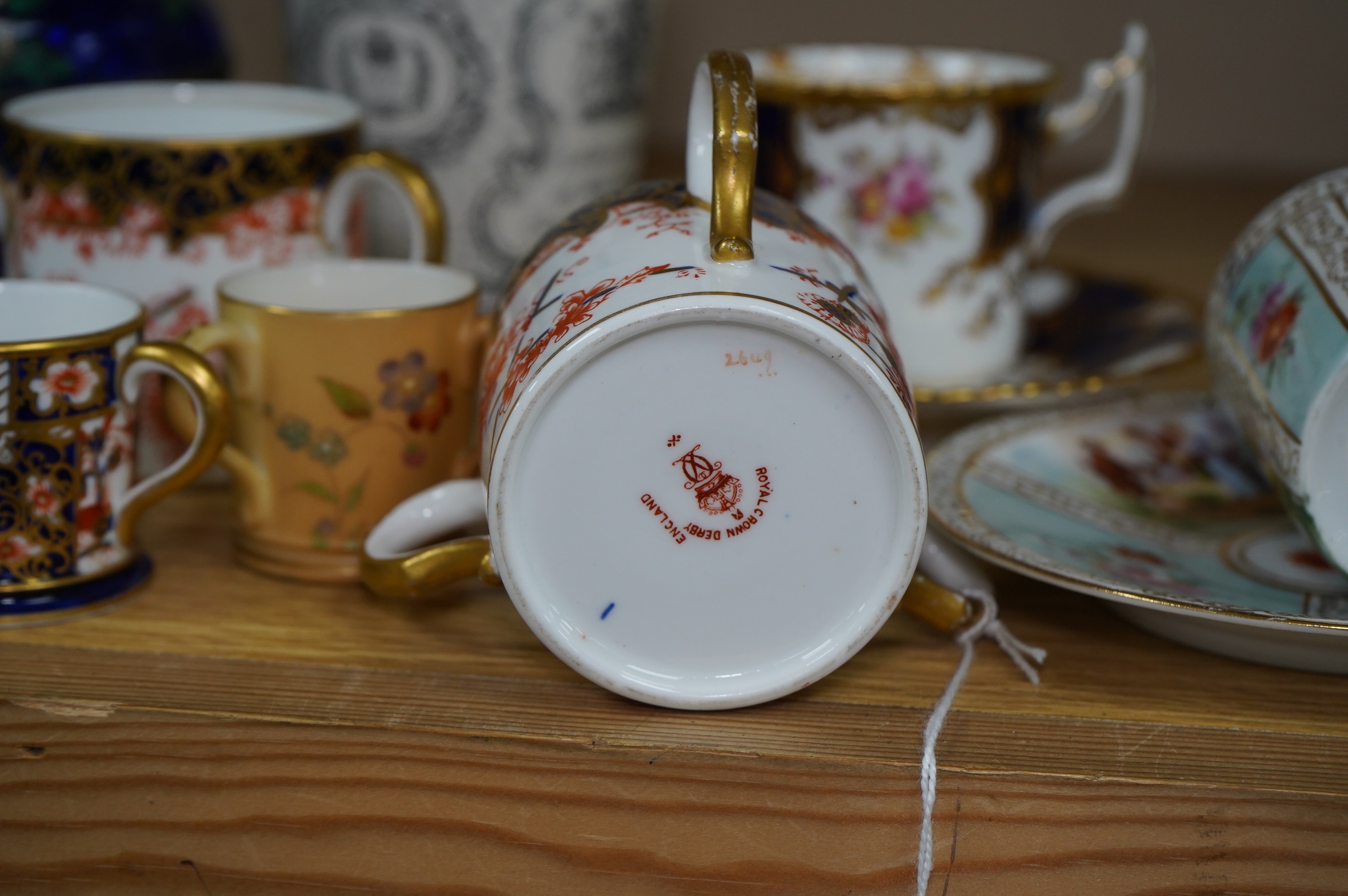 Porcelain and cloisonné ware to include a box and cover, a modern cloisonne dish, Royal crown Derby tygs and two cups and saucers, largest 10cm high. Condition - fair to good